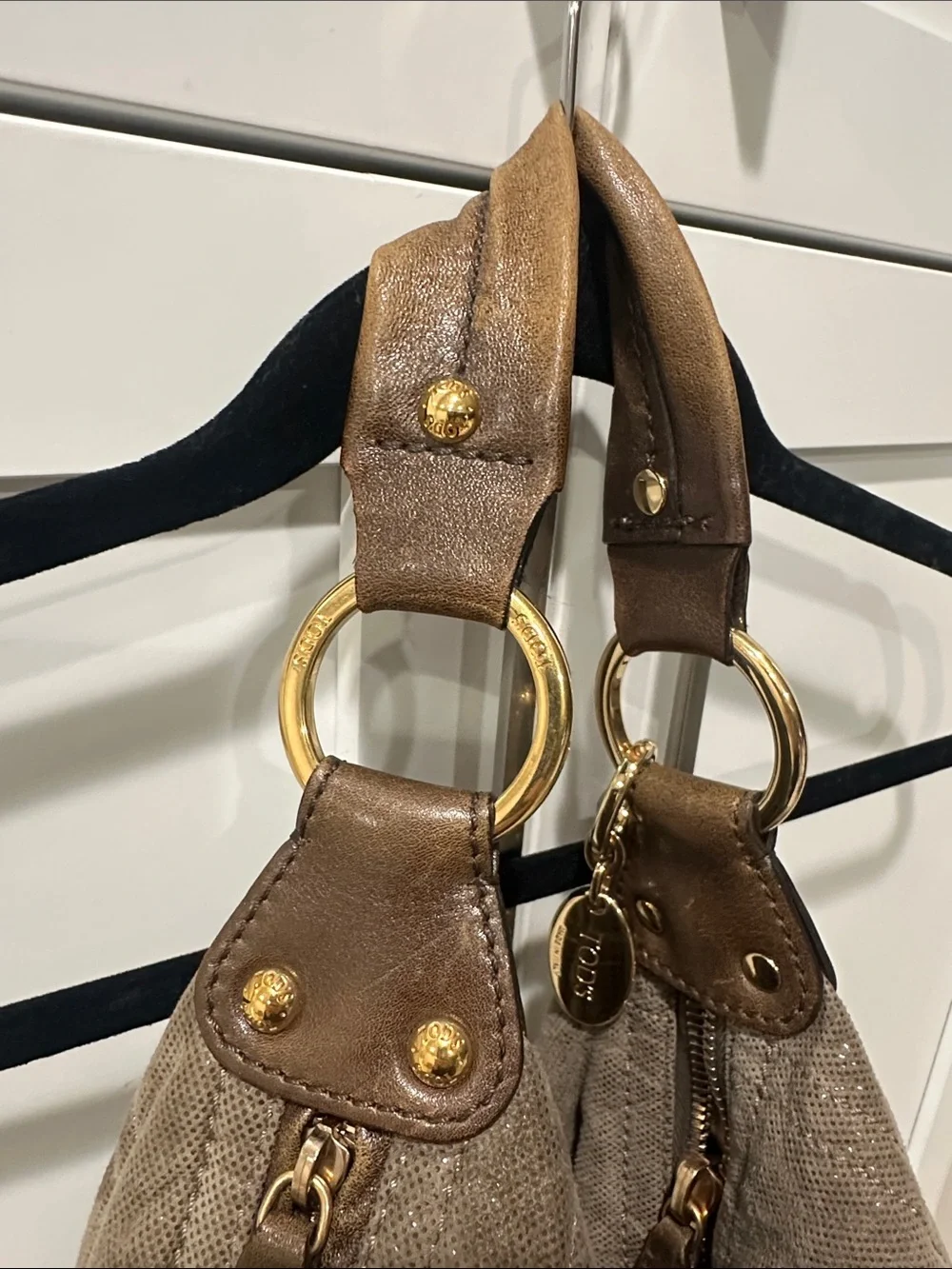 Tod’s Soft Metallic Taupe Hobo Bag with Gold Hardware. Lots of pockets,